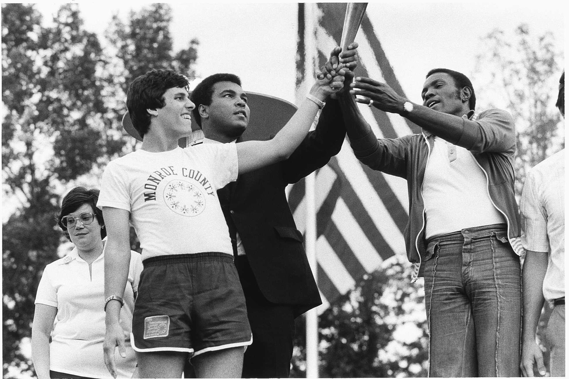 Special Oympics athletes hold up U.S. flag