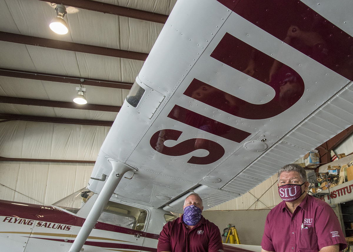 SIU logo on the underside of an airplane wing