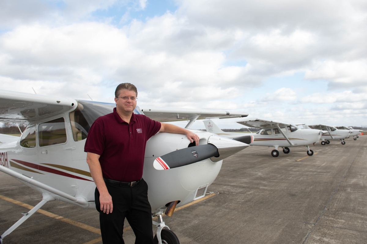 Aviation program chair Mike Burgener with new Cessna 172s planes