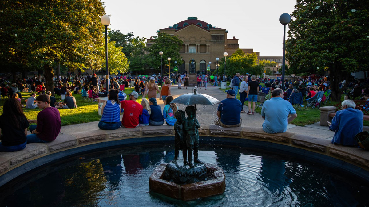 people gathered outside for a concert