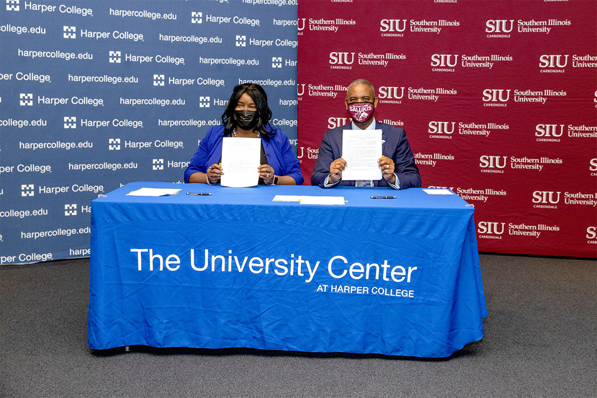 City College of Chicago Chancellor Juan Salgado and Chancellor Lane celebrate the agreements between their institutions. (SIU photo)