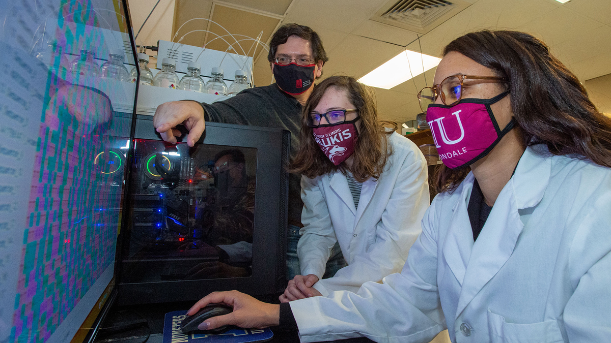 3 people, in a lab, wearing masks