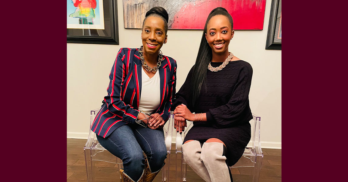 Mother-daughter graduates, seated and smiling