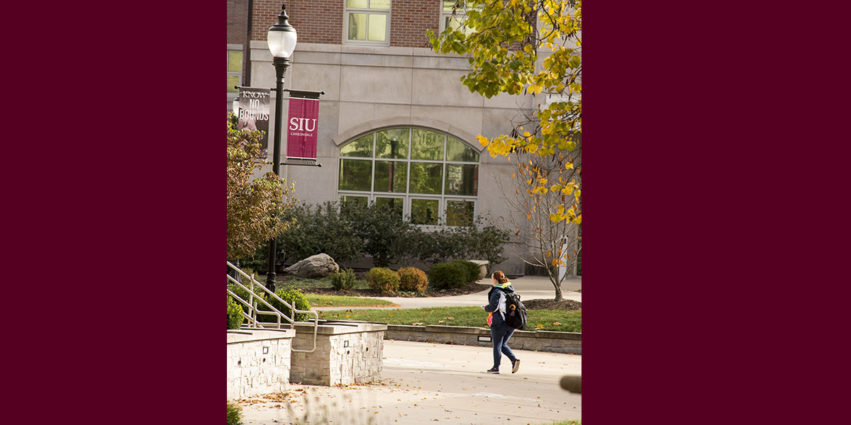 woman walking on campus