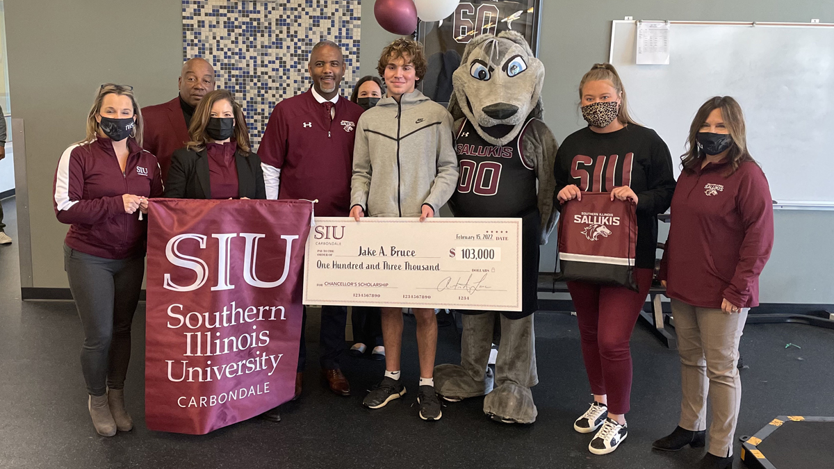 a student at Marion High School, receives a surprise visit from Chancellor Austin A. Lane, other university officials and Grey Dawg to congratulate him on receiving the Chancellor’s Scholarship