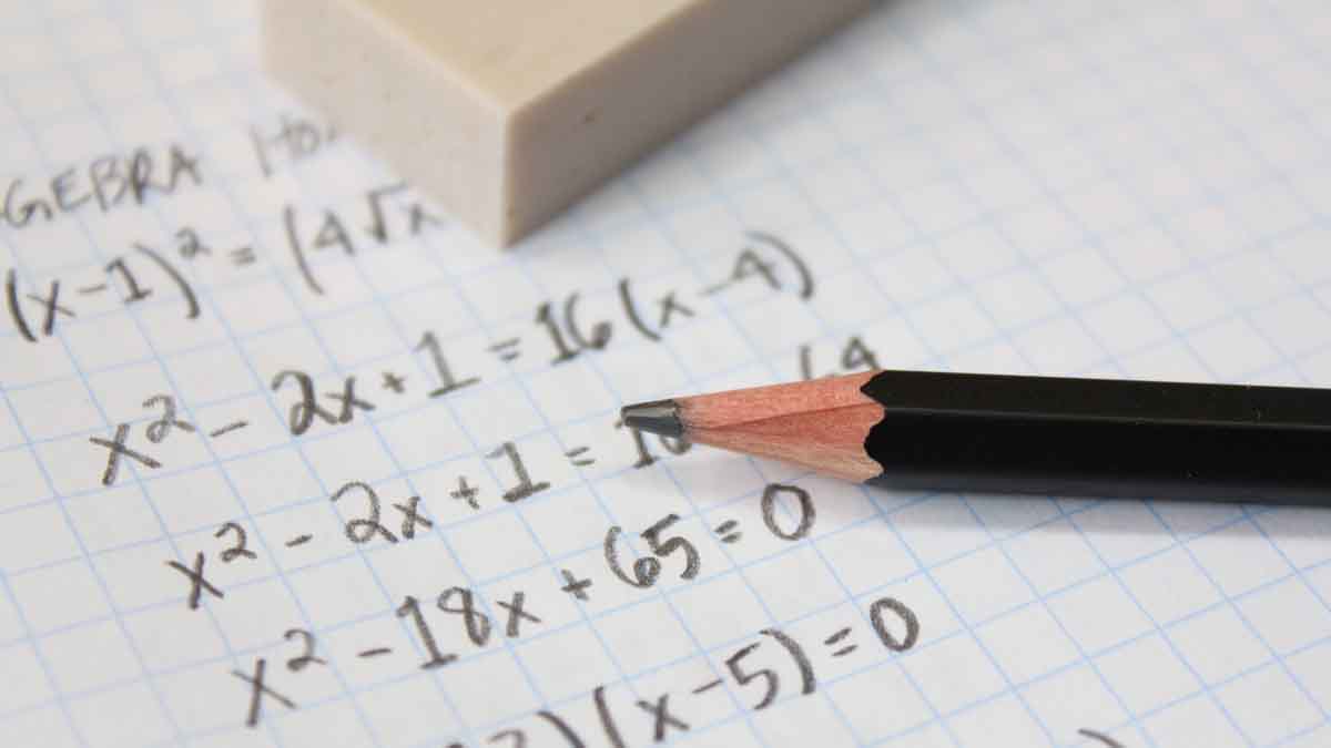 math equations on paper and a pencil