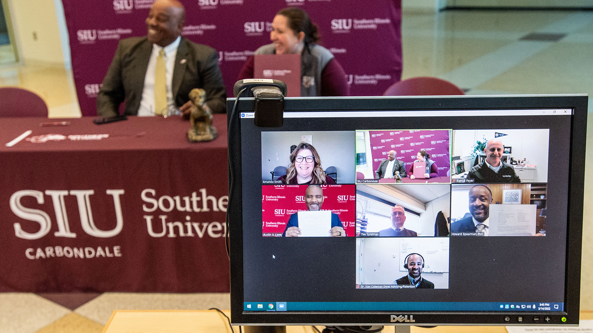 people, in person, and virtually, celebrating the signing of the Saluki Step Ahead agreement