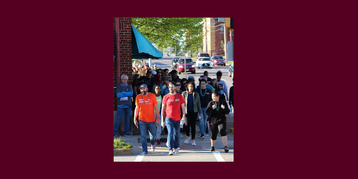 people walking on a sidewalk