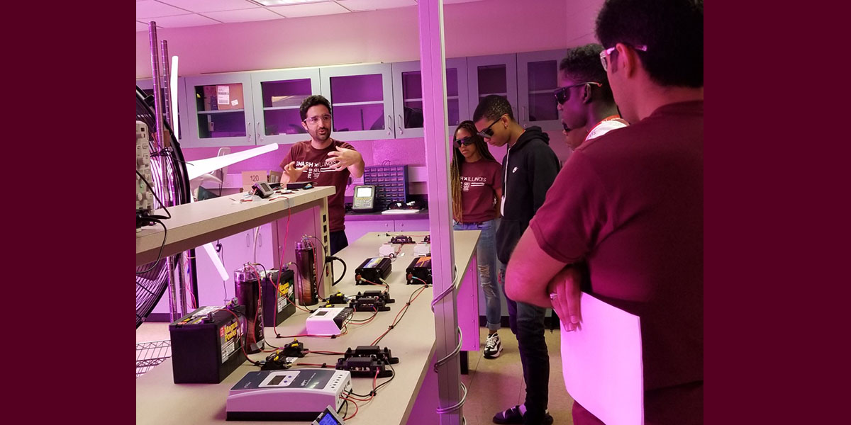 students and teacher, working in a lab