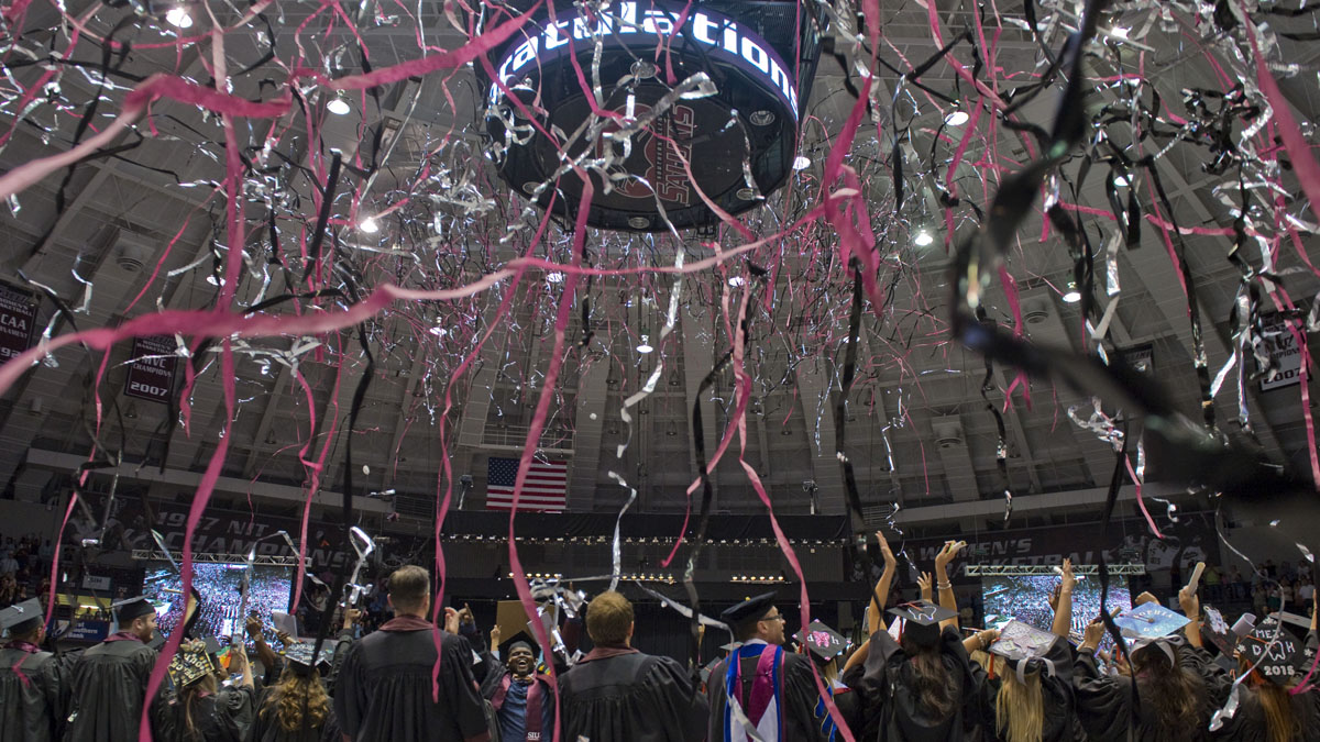 graduation ceremony with streamers floating in the air
