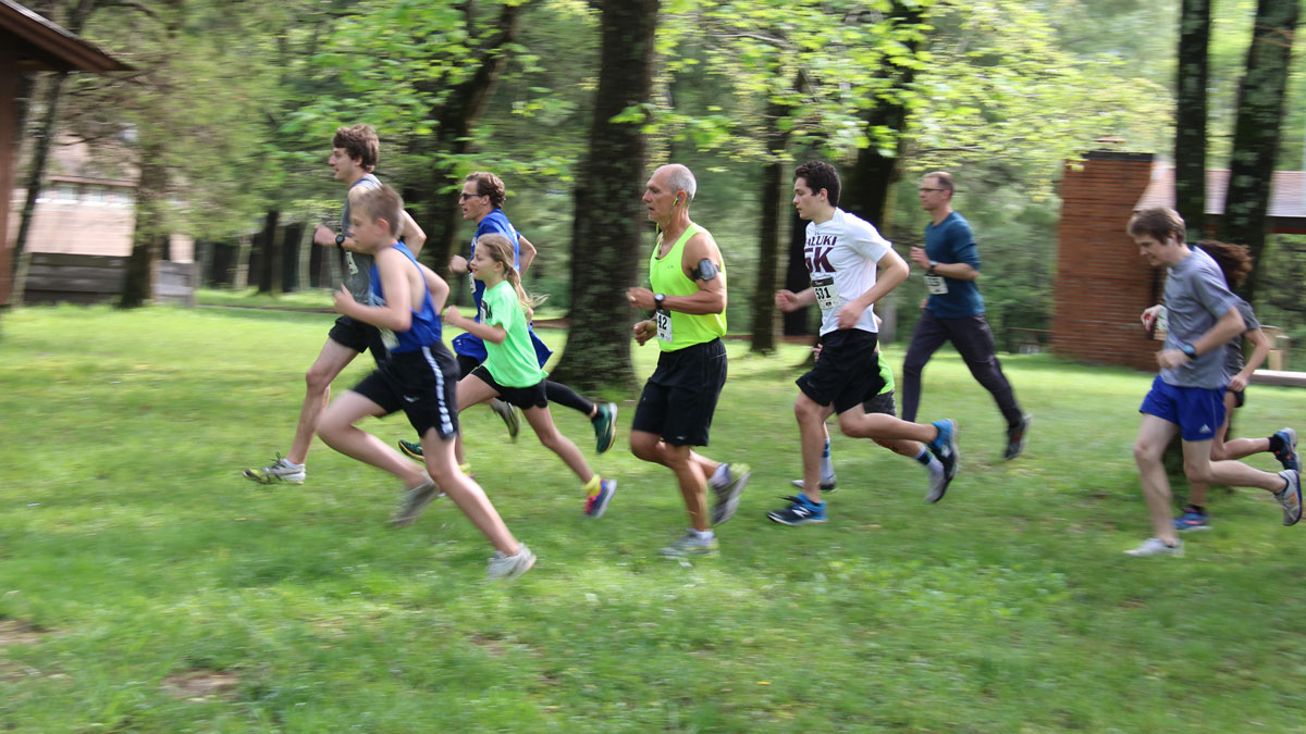 people running in the woods