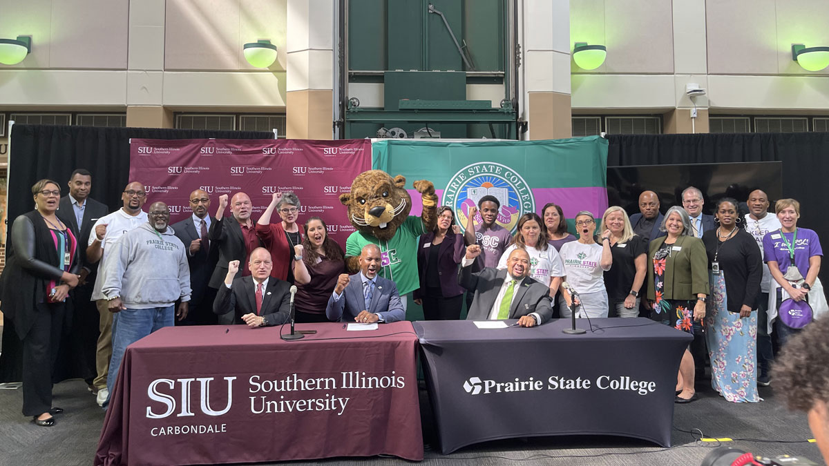 Representatives from SIUC and Prairie State College celebrate signing the Saluki Step Ahead agreement.