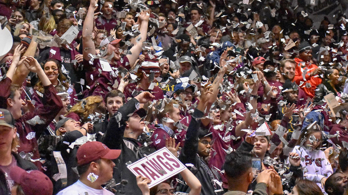 students cheering at a basketball game