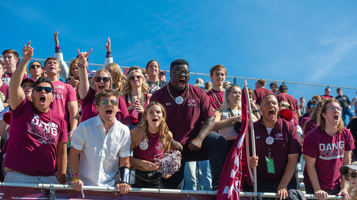 Saluki fans cheering in the stands at the 2022 Homecoming game