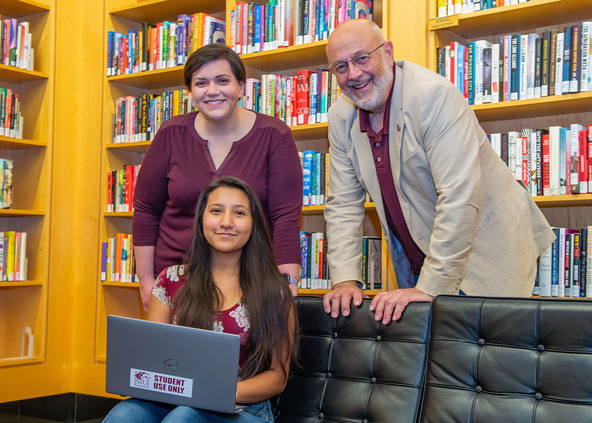 A student is seen using one of the newly donated laptops available for student use.