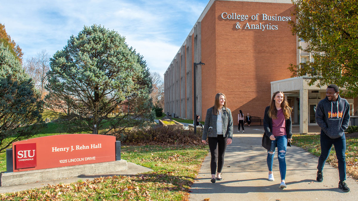 Students walking in front of the College of Business building