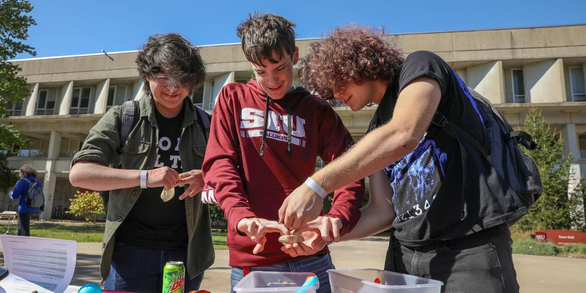 students stop and smile for the camera