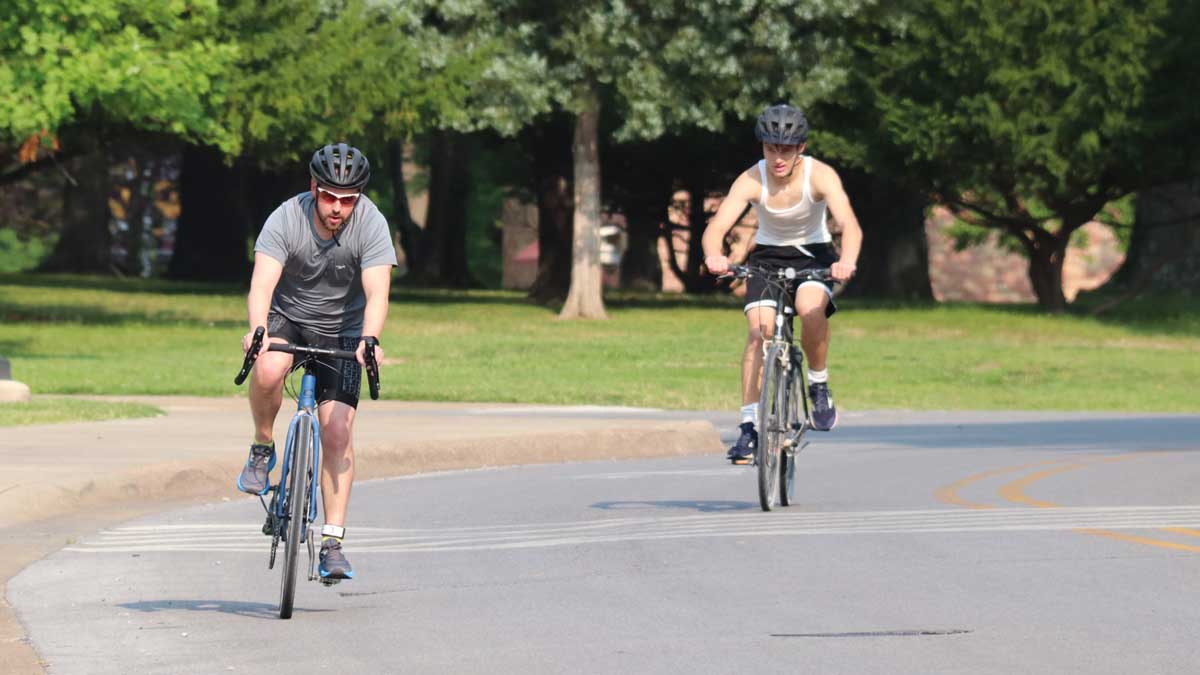 Men riding bikes