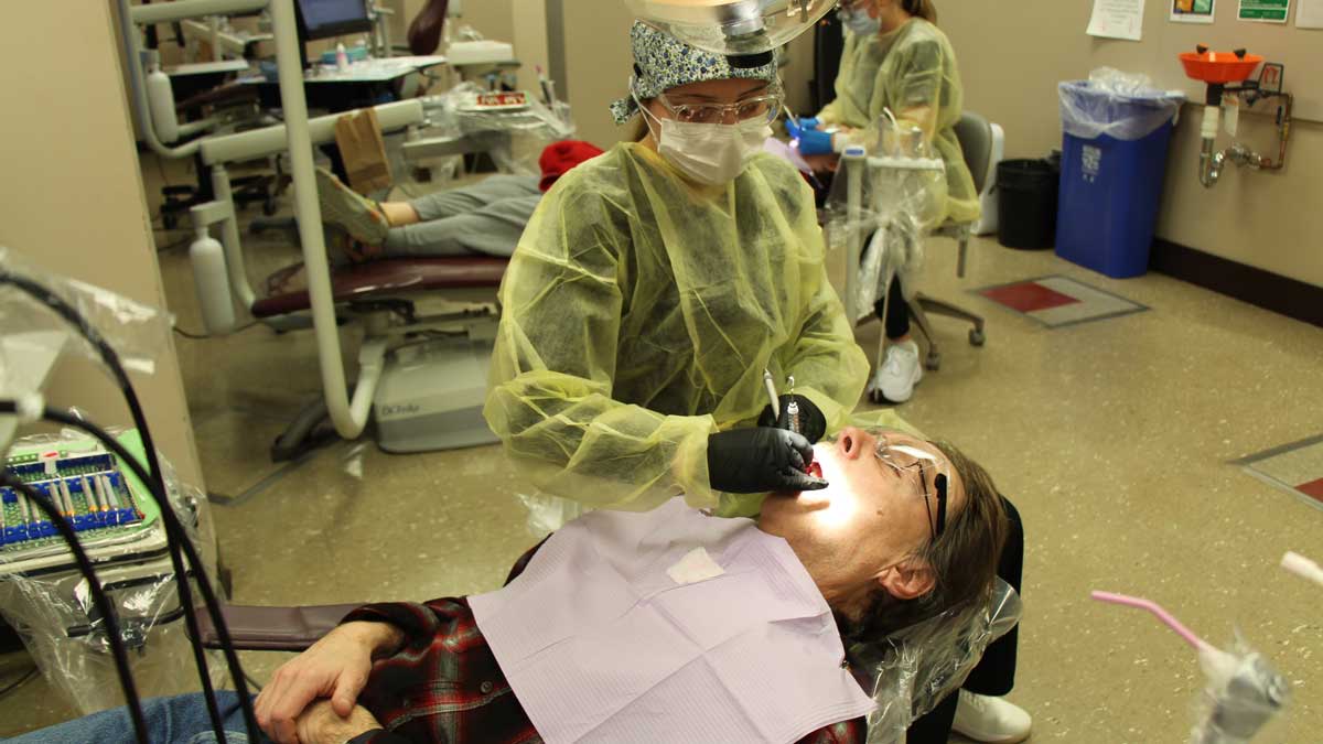 A man is getting a dental checkup