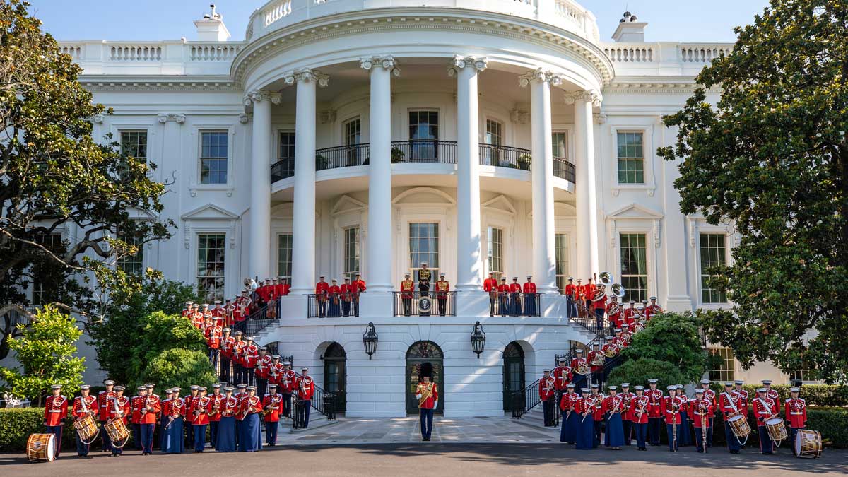 U.S. Marine Band poses for a photo outside the White House