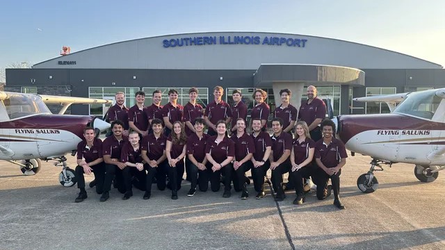 The Flying Salukis pose for a picture outside the hanger at Southern Illinois Airport