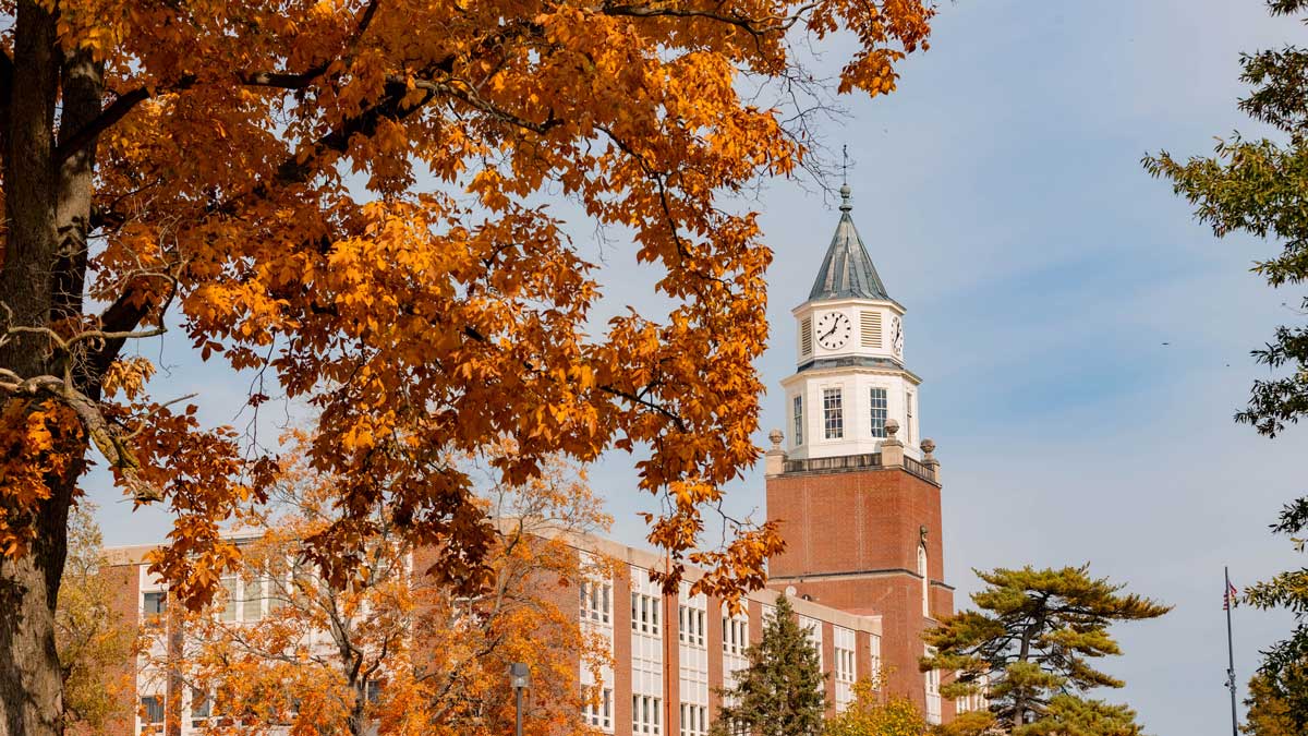 Pulliam Hall surrounded by fall foliage.