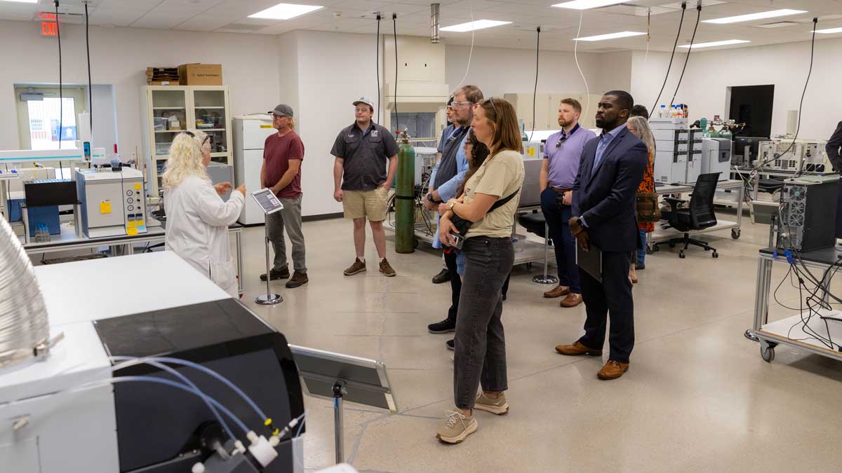 A group of people touring research space.