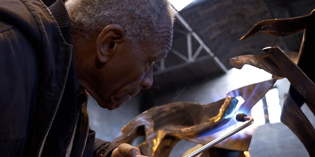 Richard Hunt works on an art piece.