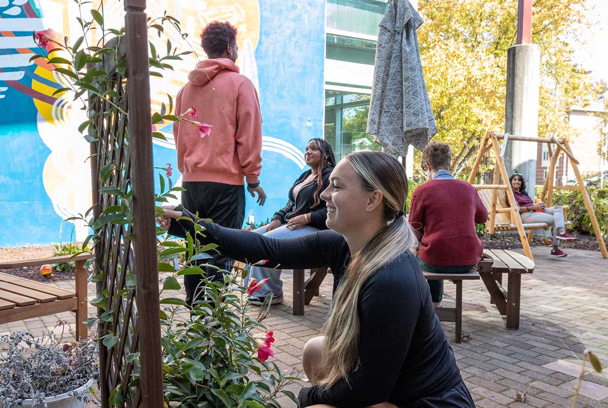 Students work in the Saluki Covid and Memorial Wellness Garden at SIU Carbondale.