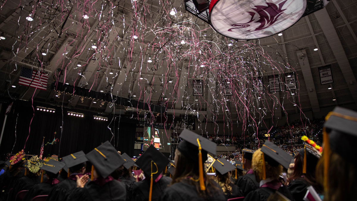 Streamers fly through the air at graduation.