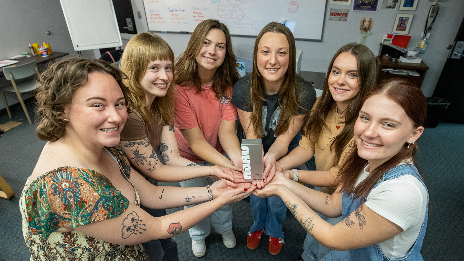 A group of students standing in a semicircle.