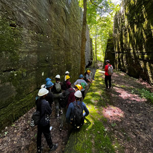 A group hiking at Shawnee National Forest’s Panther Den wilderness area. 