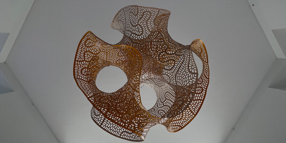 A gyroid suspended from the ceiling.