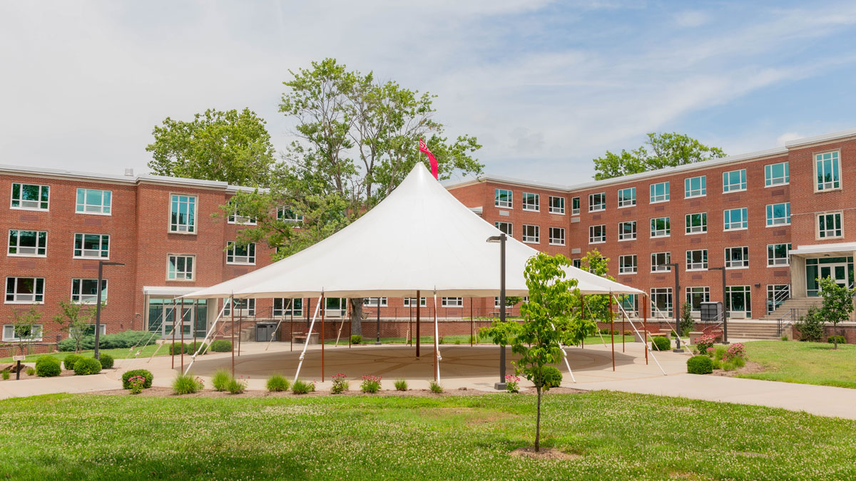 A large tent in a courtyard.