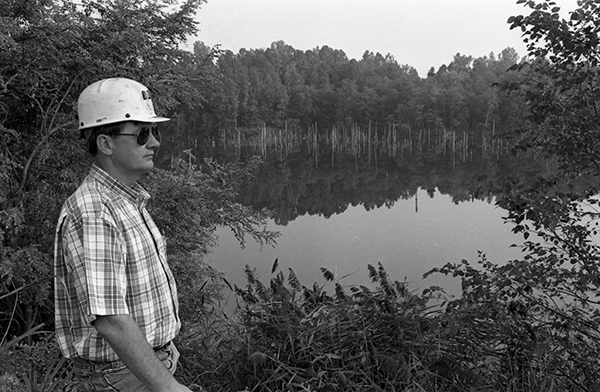 A man looks over a retired coal mine.