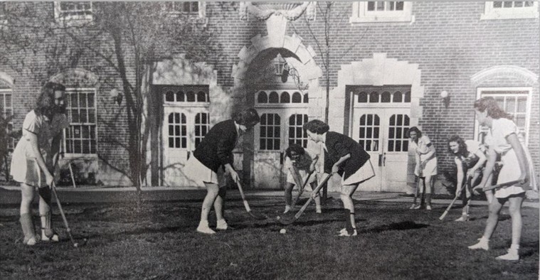 Black and white photo from 1947 showing female students playing croquet in front of Davies Hall.