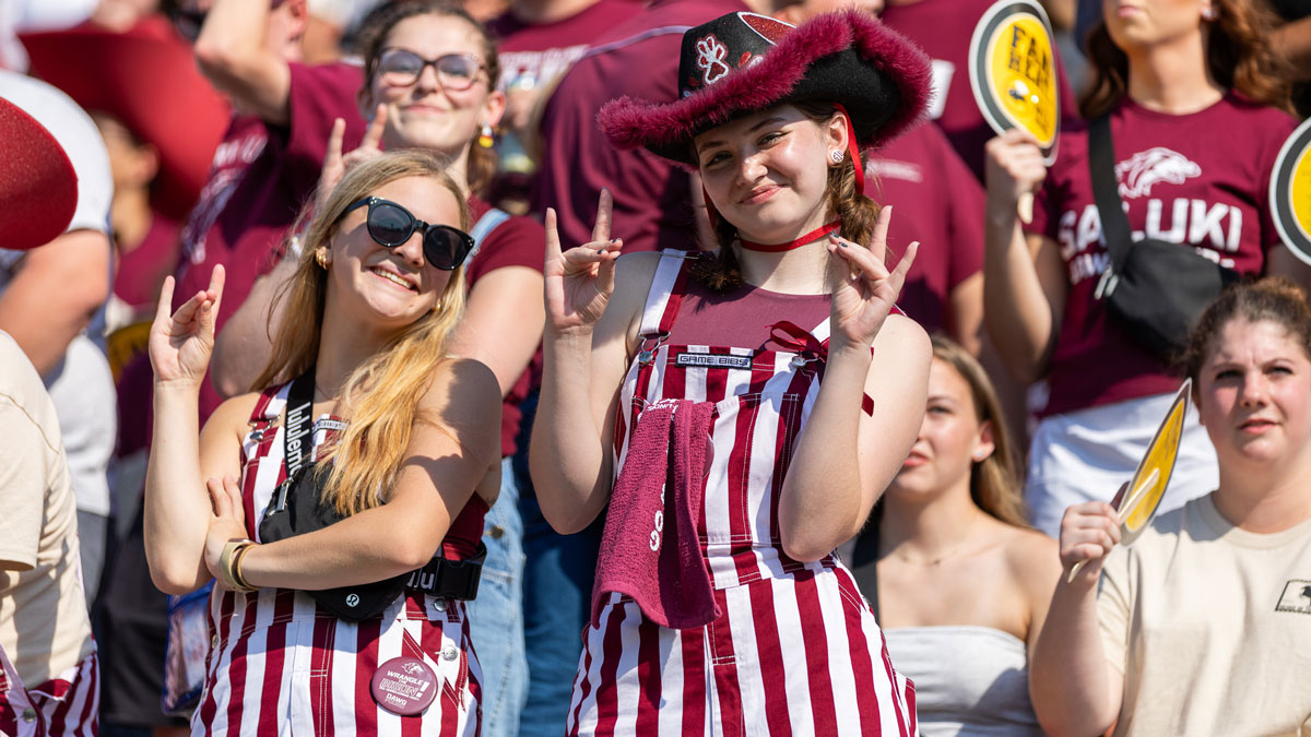 The student section at Saluki Stadium is cheering on the Saluki Football team.