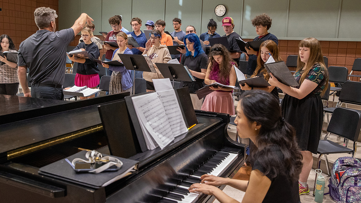 Choir members singing.