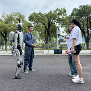 Three people and a robot.