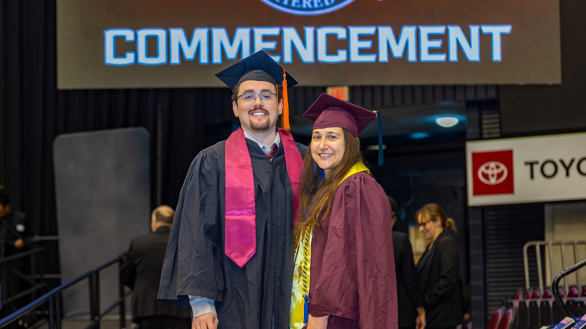 Husband and wife graduate college together.