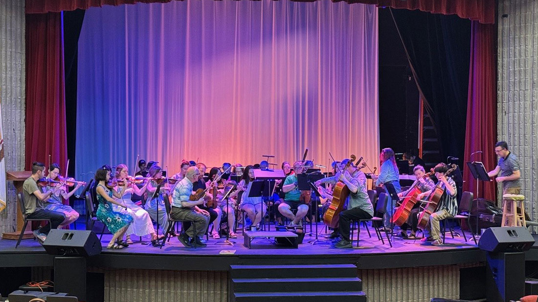 Symphony practice on stage.