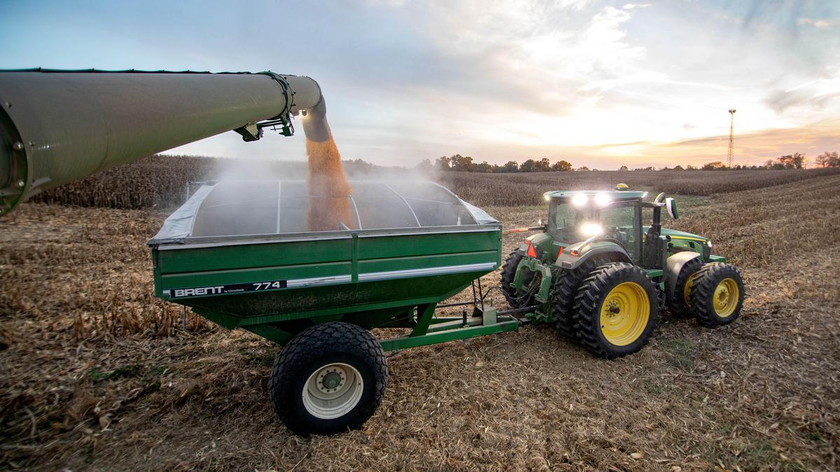 A tractor harvesting in a field.
