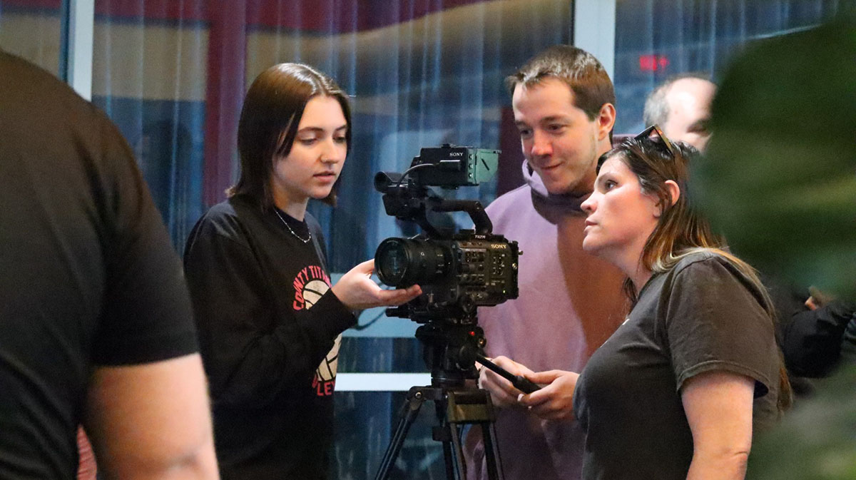 Film and TV Training participants work with a video camera.