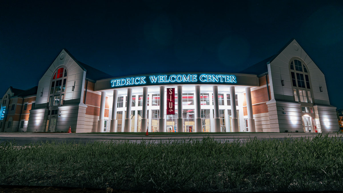Tedrick Welcome Center entrance, at night.