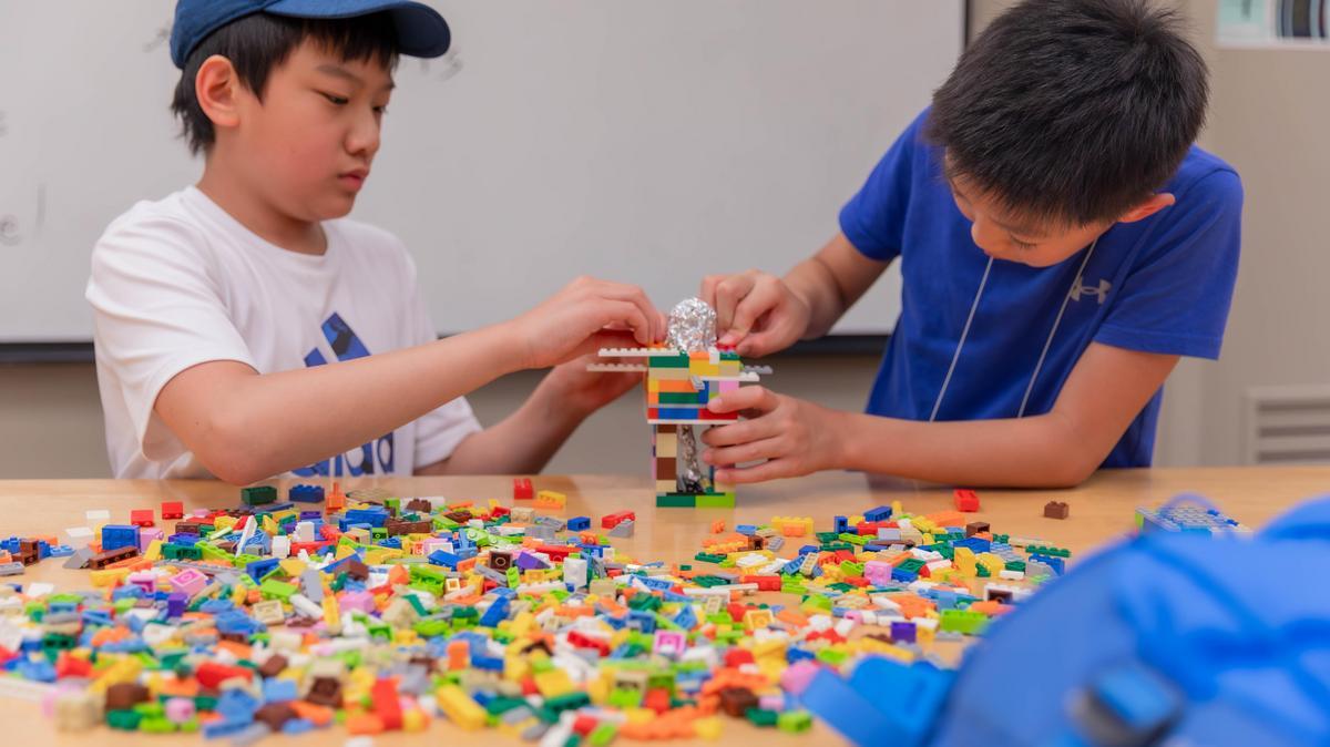 Children building with Lego blocks at a previous summer camp at SIU Carbondale.