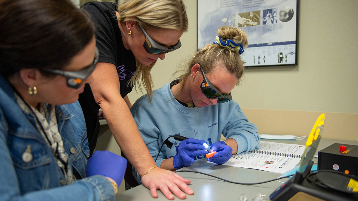 Dental Hygiene students practicing with lasers.