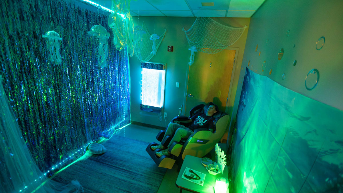 A student is relaxing in the Callen Ocean Room.
