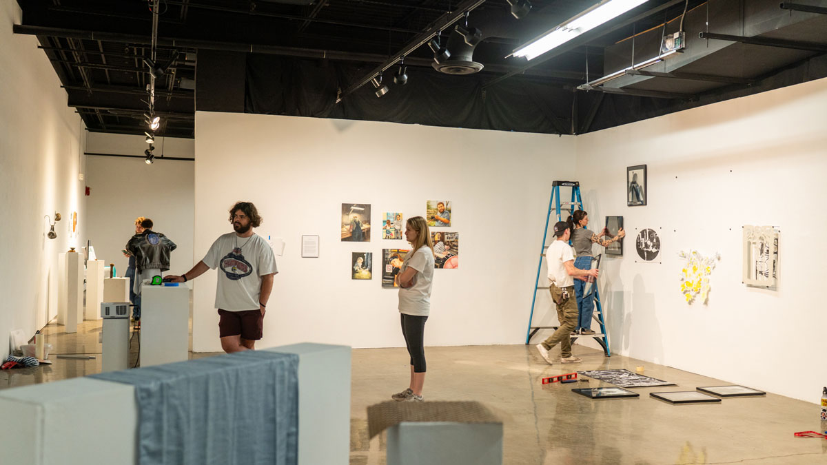Seniors preparing their work for exhibition.