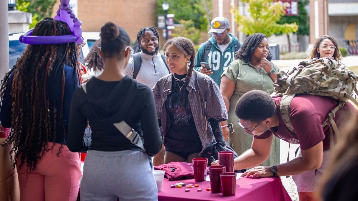 Students gathered around a table 
