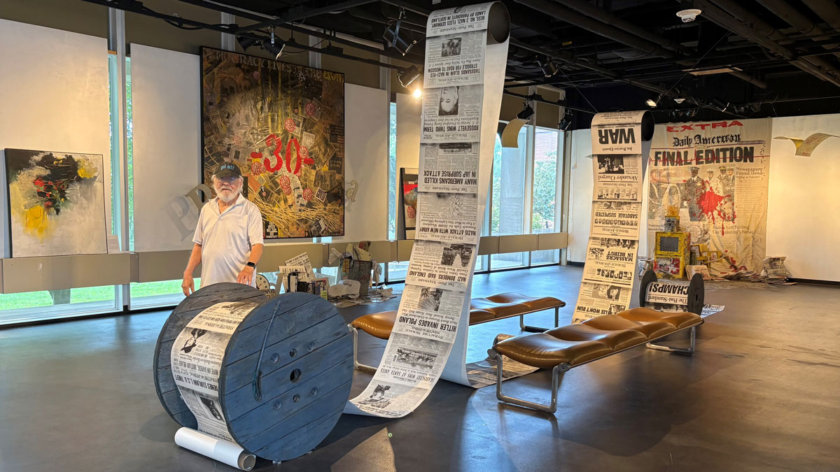 Tim Atseff alongside one of his exhibits at the Sharp Museum at SIU Carbondale.